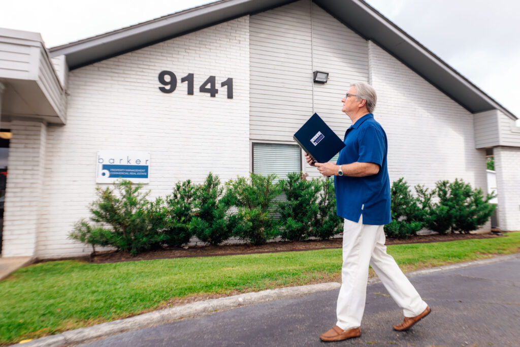 A man walking with a folder